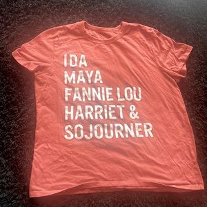 Large citrine t-shirt. Rustic orange with white writing.